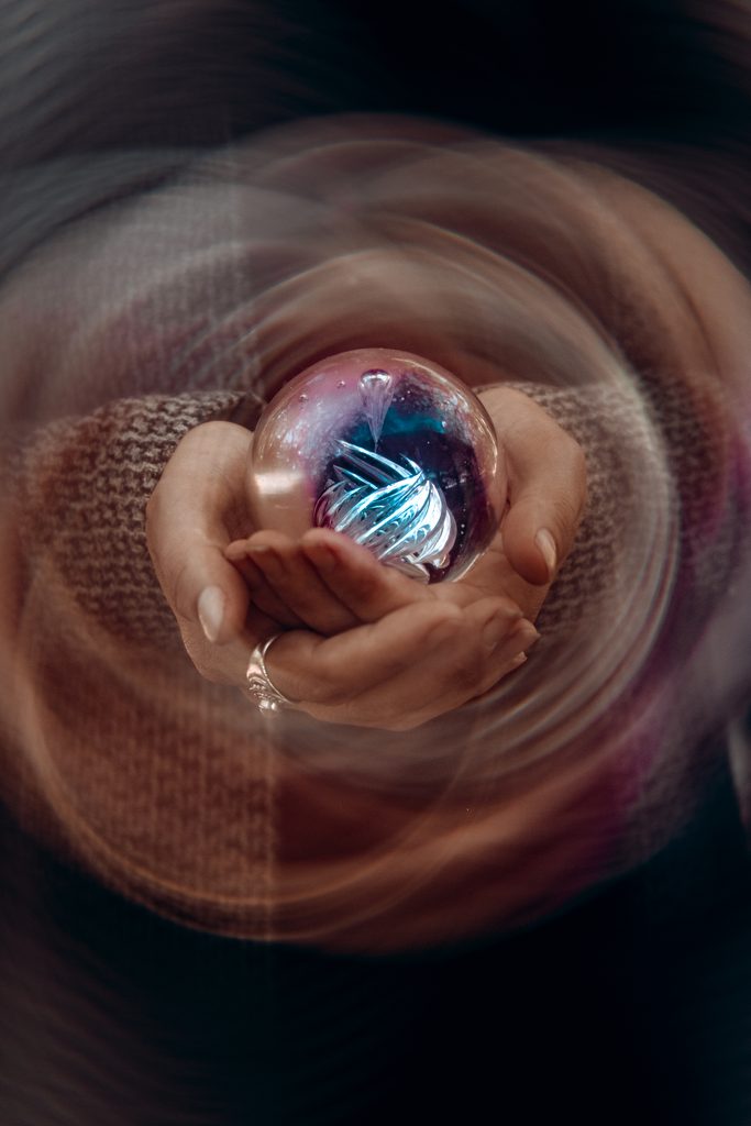 Witchy dark fantasy portrait featuring a distinct swirl lens vortex effect, captured in Central Florida.