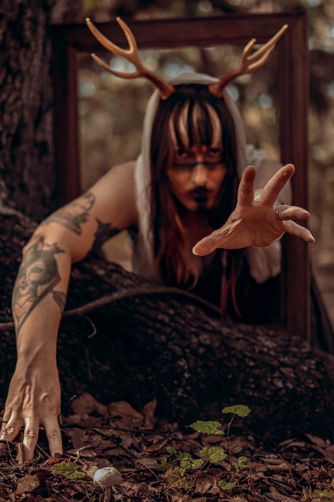 Cinematic dark fantasy portrait of a horned antler guardian in a misty forest, Central Florida fine art photography.